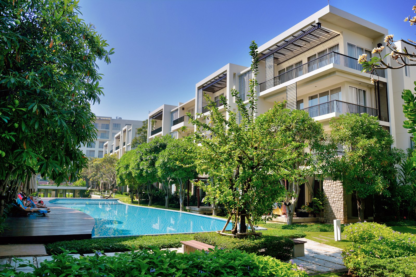 Well-kept multifamily residential property with mature landscaping